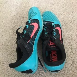 Blue and pink Nike cleats